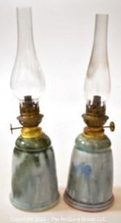 Pair of Hand Thrown Pottery Oil Lamps with Glass Shades made by Edgecomb Potters of Maine.   Each measures 14" tall with shade. 