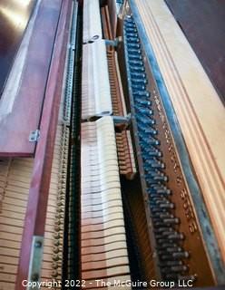 Jesse French & Sons Upright Piano with Bench.  Measures 23" x 37" x 57".  This item must be moved by buyer. 