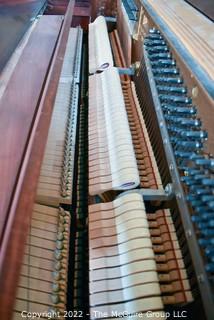 Jesse French & Sons Upright Piano with Bench.  Measures 23" x 37" x 57".  This item must be moved by buyer. 