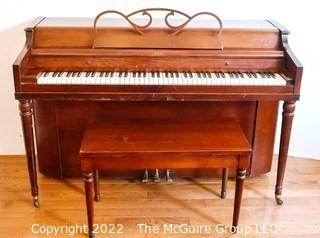 Jesse French & Sons Upright Piano with Bench.  Measures 23" x 37" x 57".  This item must be moved by buyer. 