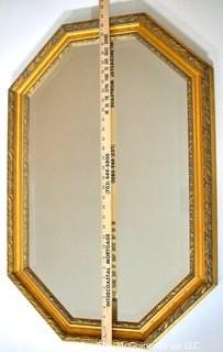 Octagon Shaped Gilt Framed Wall Mirror.  Measures 22" x 34".