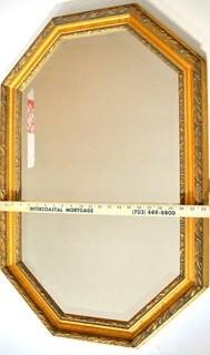 Octagon Shaped Gilt Framed Wall Mirror.  Measures 22" x 34".