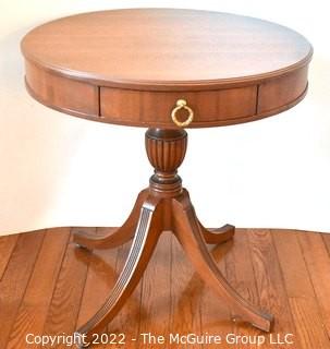 Mahogany Pedestal Single Drawer Four Leg Drum Table.  Measures 27" in diameter and 29" tall.