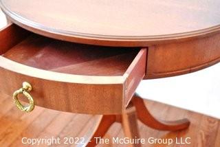 Mahogany Pedestal Single Drawer Four Leg Drum Table.  Measures 27" in diameter and 29" tall.