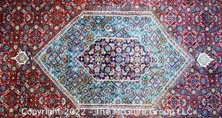 Vintage Traditional Hand Knotted Oriental Rug with Center Medallion and Border Design on Red Ground.  Measures 112" x 147".