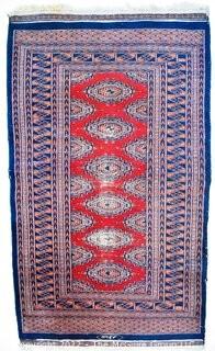 Vintage Traditional Hand Knotted Persian or Oriental Rug with Repeated Medallion on Red Base. Measures 37" x 66".