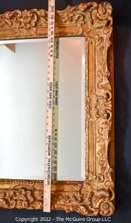 Ornate Gilt Framed Wall Mirror.  Measures 27" x 32".