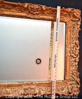 Ornate Gilt Framed Wall Mirror.  Measures 27" x 32".