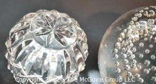 Two (2) Hand Blown Glass Paperweights and Crystal Votive. 