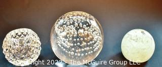 Two (2) Hand Blown Glass Paperweights and Crystal Votive. 