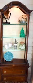 Victorian Glass Front Cabinet with Two Drawer Base.  Decorative items on shelves not included. 
 Measures 23" x 67".