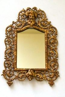 Vintage Ornate Gilt Painted Cast Iron Framed Wall Mirror with Figural Bacchus Wine God Decoration.   Measures 14" tall.  This is the first of two of these mirrors being offered.