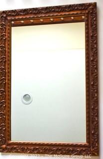 Ornate Framed Wall Mirror. Measures 26"x 38".