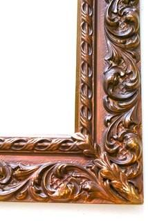 Ornate Framed Wall Mirror. Measures 26"x 38".