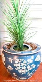 Large Asian Hand Painted on Blue Ground Porcelain Fish Bowl Planter with Faux Plant. Measures 12" Tall  x 14" Diameter.