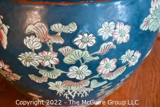 Large Asian Hand Painted on Blue Ground Porcelain Fish Bowl Planter with Faux Plant. Measures 12" Tall  x 14" Diameter.