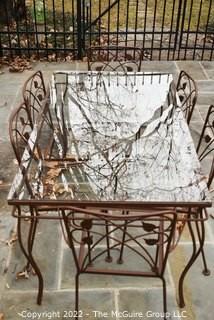 Vintage Wrought Iron Garden Dining Table with Glass Top and Six Flower Back Chairs.  Chair seat inserts in additional photo.  Table measures 54" long and 32" wide. Includes vinyl cover.

