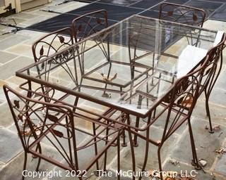 Vintage Wrought Iron Garden Dining Table with Glass Top and Six Flower Back Chairs.  Chair seat inserts in additional photo.  Table measures 54" long and 32" wide. Includes vinyl cover.

