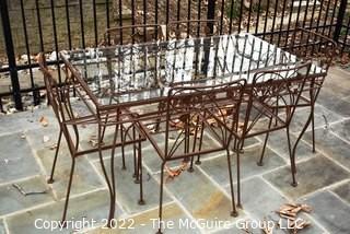 Vintage Wrought Iron Garden Dining Table with Glass Top and Six Flower Back Chairs.  Chair seat inserts in additional photo.  Table measures 54" long and 32" wide. Includes vinyl cover.

