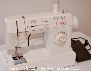 Singer Sewing Machine Model 3314C with Notions. 