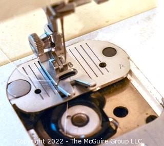 Singer Sewing Machine Model 3314C with Notions. 