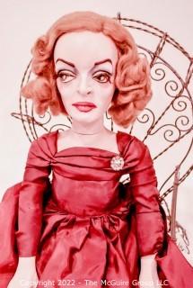 Artisan Made Bette Davis as  Margo Channing Doll in "All About Eve" with Framed Lobby Card from Movie. Signed by artist but signature illegible.  Includes wire chair. Measures 28" long.  Last photo shows Bette holding this doll.