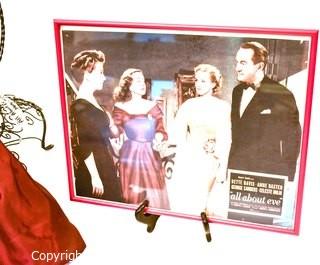 Artisan Made Bette Davis as  Margo Channing Doll in "All About Eve" with Framed Lobby Card from Movie. Signed by artist but signature illegible.  Includes wire chair. Measures 28" long.  Last photo shows Bette holding this doll.