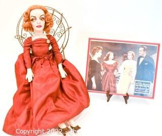 Artisan Made Bette Davis as  Margo Channing Doll in "All About Eve" with Framed Lobby Card from Movie. Signed by artist but signature illegible.  Includes wire chair. Measures 28" long.  Last photo shows Bette holding this doll.