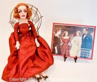 Artisan Made Bette Davis as  Margo Channing Doll in "All About Eve" with Framed Lobby Card from Movie. Signed by artist but signature illegible.  Includes wire chair. Measures 28" long.  Last photo shows Bette holding this doll.