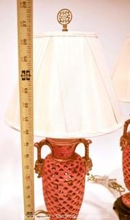 Pair of Asian Inspired Red Pierced Porcelain Table Lamps with Shades. Each measures 27" with shade.