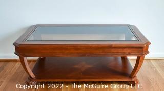 Contemporary Glass Insert Coffee Table with Marquetry Medallion on Lower Shelf. Measures 30" W x 50"L x 16"T.