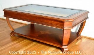 Contemporary Glass Insert Coffee Table with Marquetry Medallion on Lower Shelf. Measures 30" W x 50"L x 16"T.