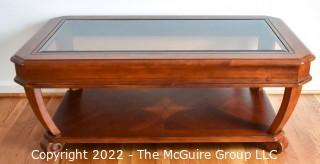 Contemporary Glass Insert Coffee Table with Marquetry Medallion on Lower Shelf. Measures 30" W x 50"L x 16"T.