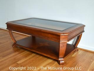 Contemporary Glass Insert Coffee Table with Marquetry Medallion on Lower Shelf. Measures 30" W x 50"L x 16"T.