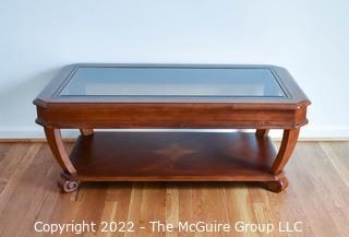 Contemporary Glass Insert Coffee Table with Marquetry Medallion on Lower Shelf. Measures 30" W x 50"L x 16"T.