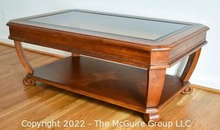 Contemporary Glass Insert Coffee Table with Marquetry Medallion on Lower Shelf. Measures 30" W x 50"L x 16"T.