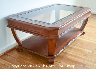 Contemporary Glass Insert Coffee Table with Marquetry Medallion on Lower Shelf. Measures 30" W x 50"L x 16"T.