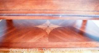 Contemporary Glass Insert Coffee Table with Marquetry Medallion on Lower Shelf. Measures 30" W x 50"L x 16"T.