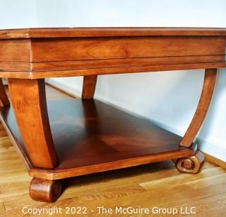 Contemporary Glass Insert Coffee Table with Marquetry Medallion on Lower Shelf. Measures 30" W x 50"L x 16"T.