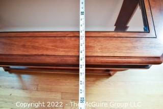 Contemporary Glass Insert Console Table with Marquetry Medallion on Lower Shelf.  Measures 20" W x 49"L x 30"T.