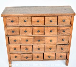 Antique 25 Drawer Wood Apothecary Chest or Cabinet.  Board on Back loose. Measures 7" x 20" x 19". 0095SM