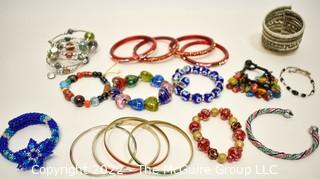 Collection of Beaded Bracelets Including Lampwork Glass, Beads, Rhinestones and Bangles.