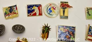 Collection of Pins and Pinbacks Including Olympic Pins from 1992 Winter Olympics in Albertville France, Summer Olympics in Atlanta Georgia and the Kentucky Derby.