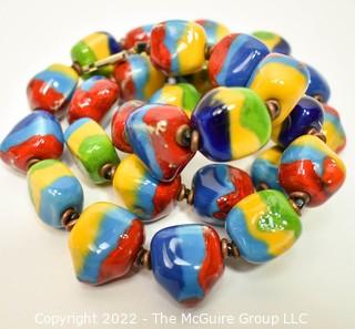 Bright Clay Artisan Made Bead Necklace. Measures 22" long. 0088CC
