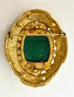 Vintage Green Cabochon Stone in Ornate Gold Surround Florenza Brooch or Pendant.  Measures 1 1/2" long. 
