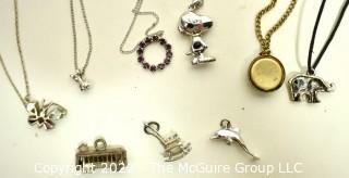 Group of Charms and Pendant Necklaces, One Sterling.  Includes Snoopy and Vintage Washington DC Souvenir Charm. 