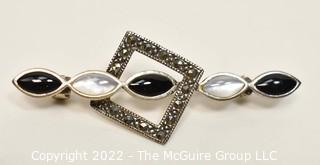 Unmarked Sterling Silver Marcasite, Onyx and Mother of Pearl Brooch.