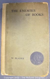 Lot 34.  William Blades.  The Enemies of Books.  London: Elliot Stock, 1902.  Hardback.  The author was a 19th-century bibliophile and book collector. First published in 1880, the book was republished in other editions in 1881, 1888, 1896 and 1902 in a popular edition. He worked with many notable collectors as well as printers, including William Claxton.  Shelf wear, and boards are heavily worn at corners.