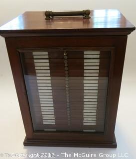 Antique Pathologists cabinet with drawers to hold glass slides; complete with brass top handle and glass door front; 15W x 13D x 19"T