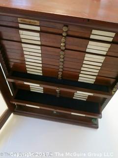 Antique Pathologists cabinet with drawers to hold glass slides; complete with brass top handle and glass door front; 15W x 13D x 19"T